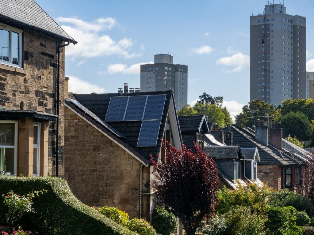 embracing a better retrofit future in Glasgow this picture is taken in southside of Glasgow where heritage homes and tower blocks loom in the background on a bright sunny day