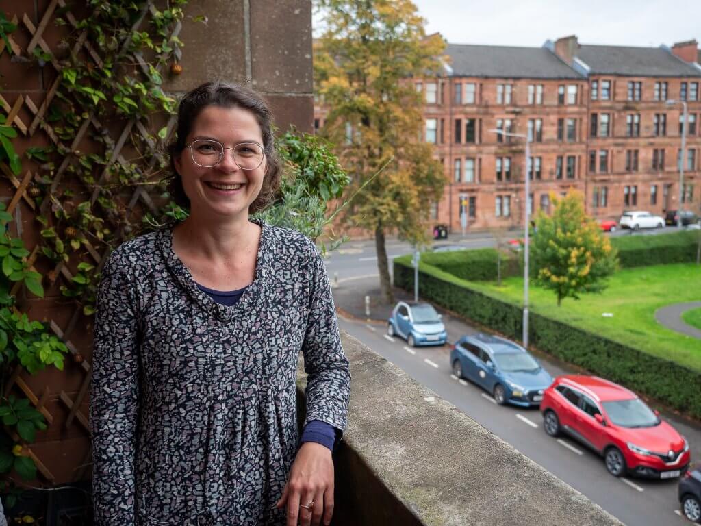 couple outside of 1930s glasgow home who have saved on their energy bills with loco home