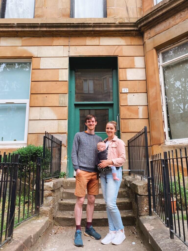 couple with baby outside home in Scotland