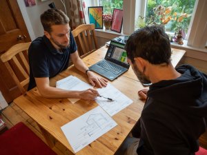 Loco Home adviser discussing retrofit plans with a customer.
