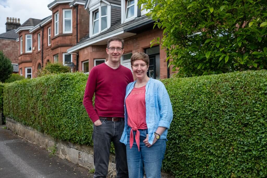 couple in glasgow in shawlands with their retrofitted home happy loco home customers couple in their 40s