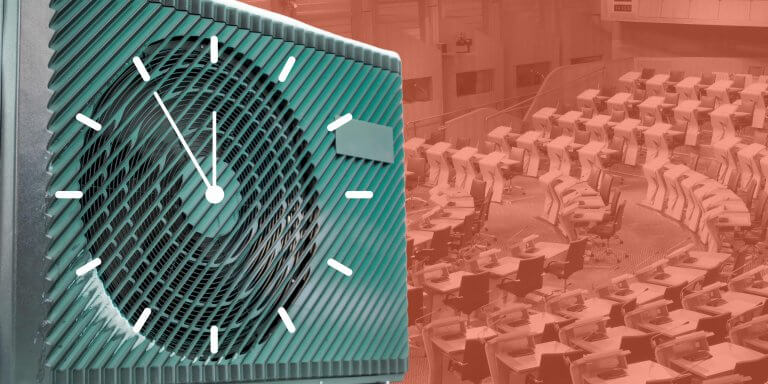 Scottish Parliament interior in the background with heat pump in green looming over and a clock is superimposed over it signifying that time is running out for Scottish Government to do more about climate change