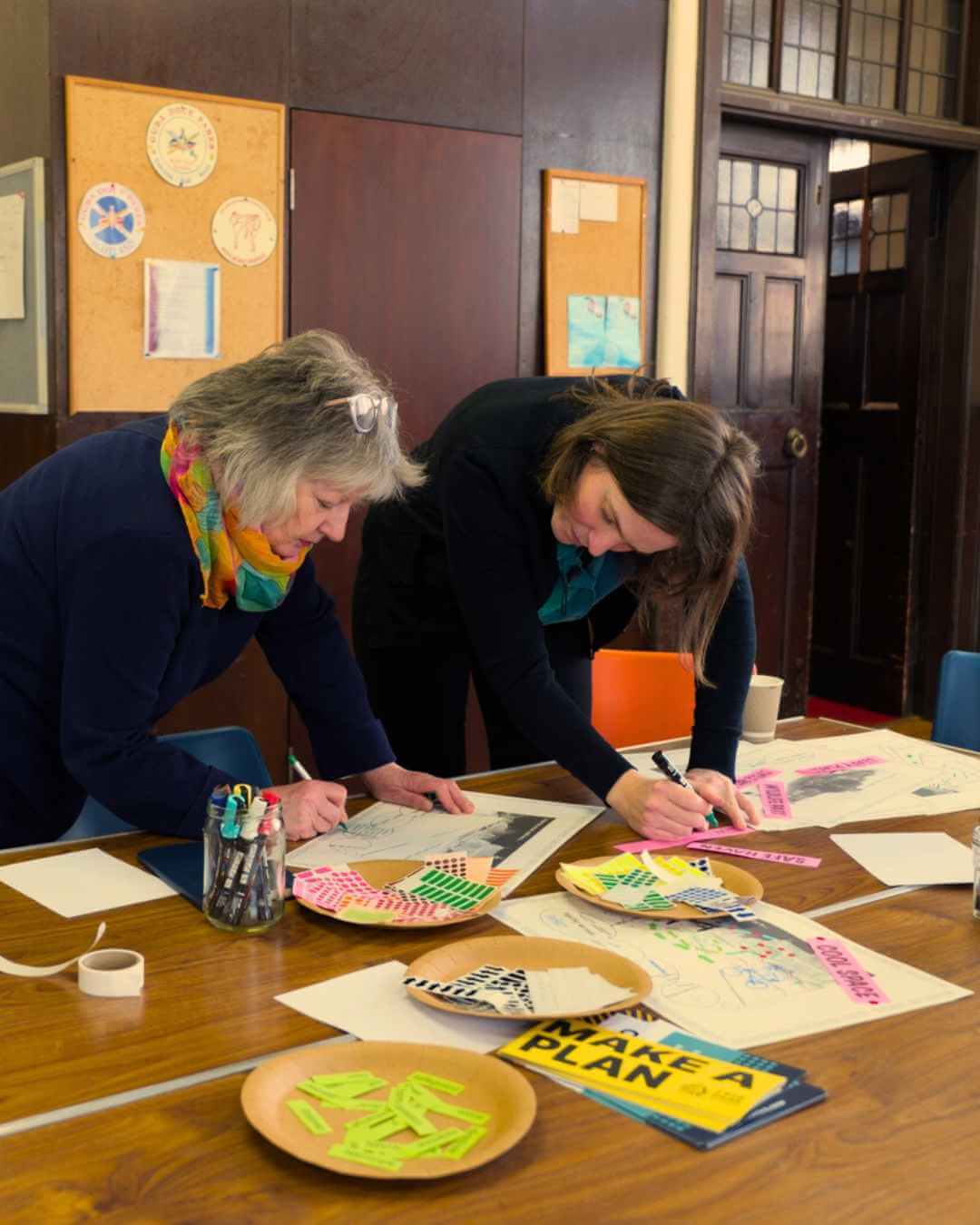 community wealth building in church hall working on community