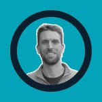 Chris our founder, black and white portrait, teal background