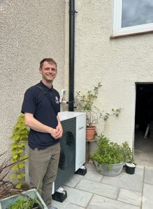 Heat pump expert angus with heat pump he helped install instead of boiler