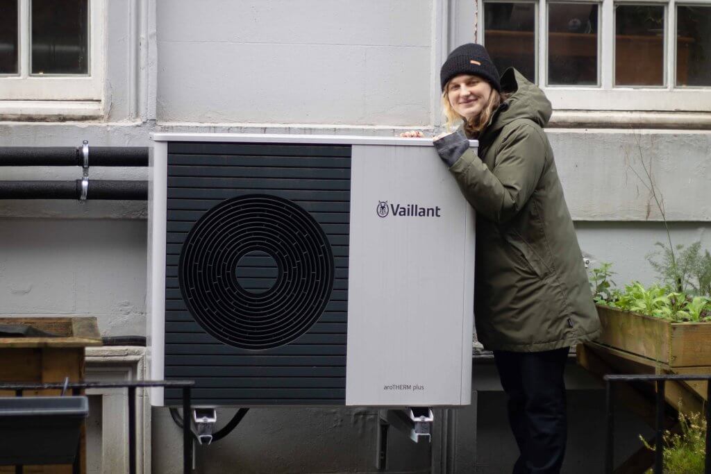 couple outside of 1930s glasgow home who have saved on their energy bills with loco home