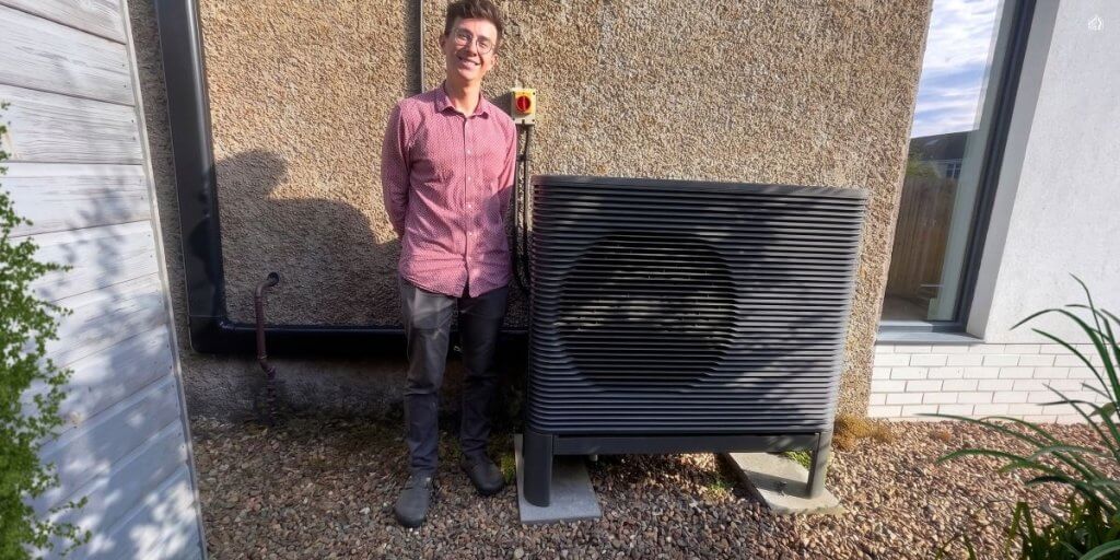 couple outside of 1930s glasgow home who have saved on their energy bills with loco home